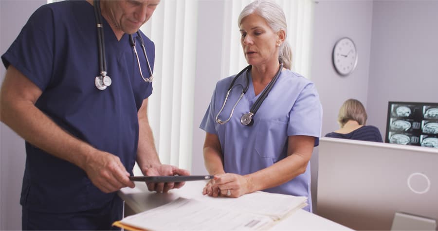 physicians reviewing radiology images